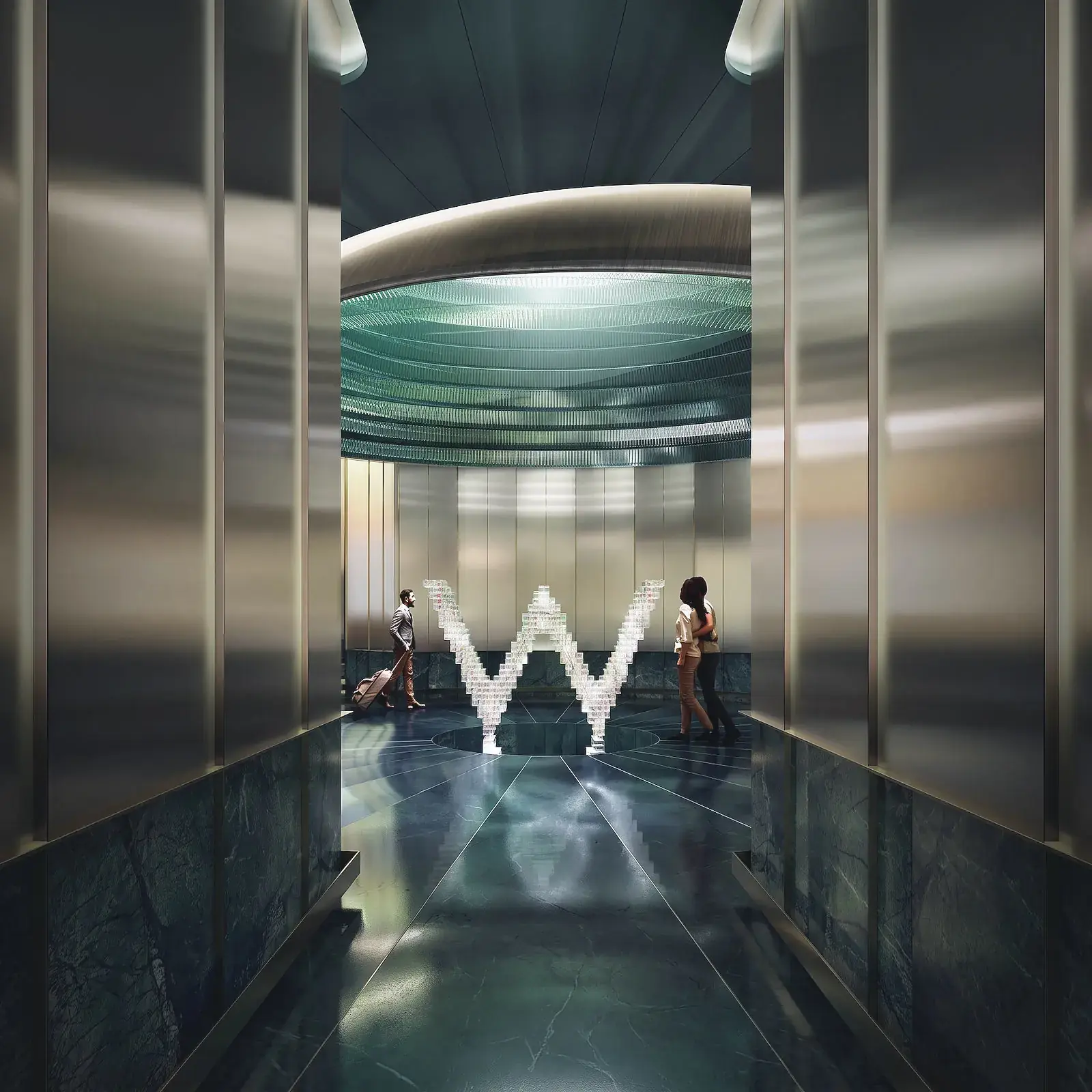 A residence lobby at night, lit by the W mark