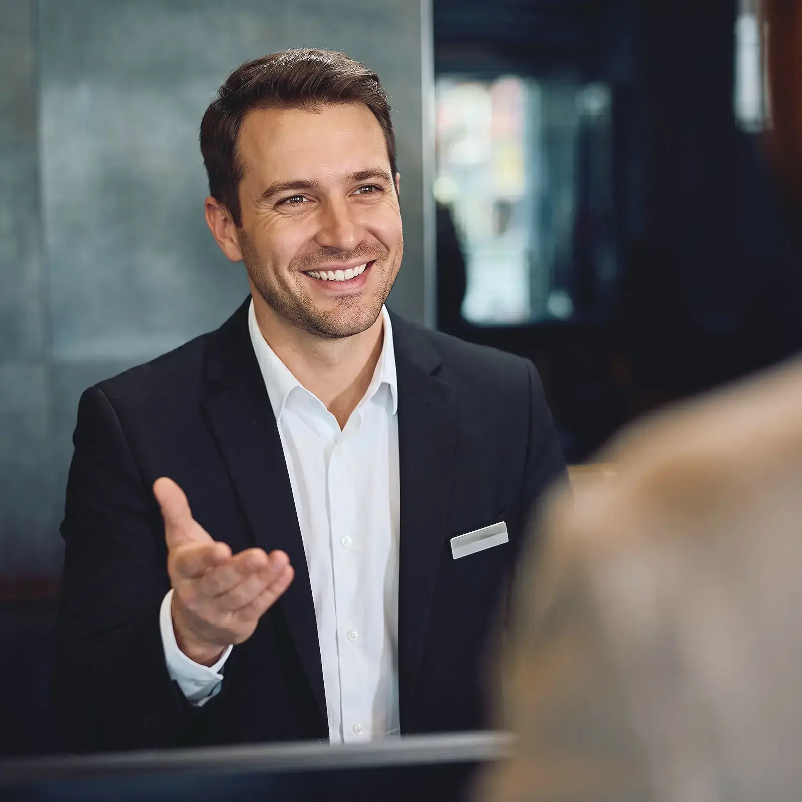 A residence manager at the concierge desk
